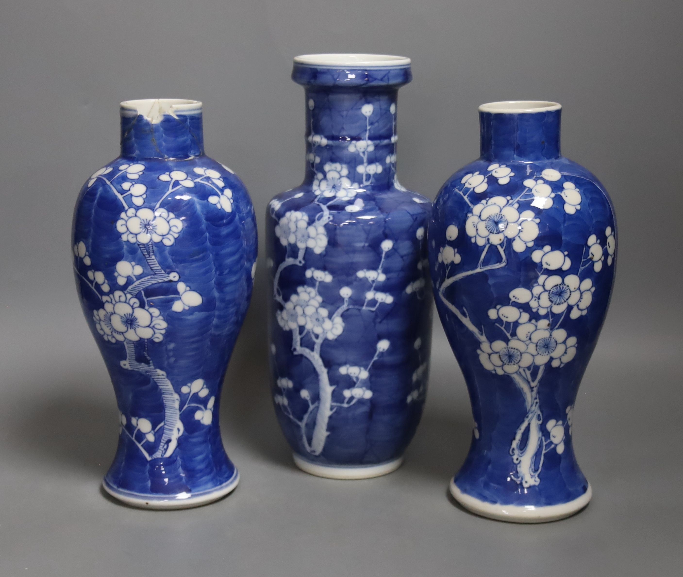 Three Chinese blue and white prunus vases. 25.5cm